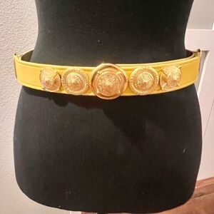 Vintage yellow belt with gold tone medallions.  Small.